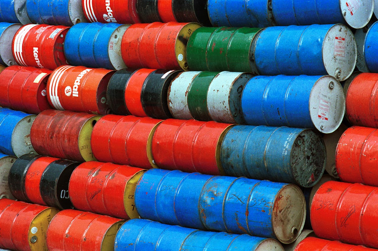 creative Vibrant stack of colorful industrial barrels, ideal for environmental or industrial themed projects.